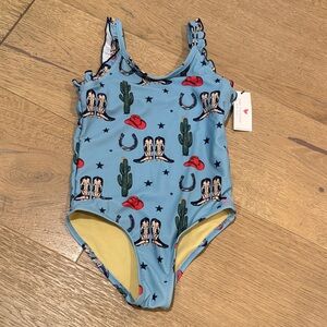 Pink Chicken Blue Swimsuit with cowboy boots, cowboy hat, cactus and horseshoe